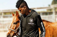 Compton Cowboy in Ariat jacket with horse
